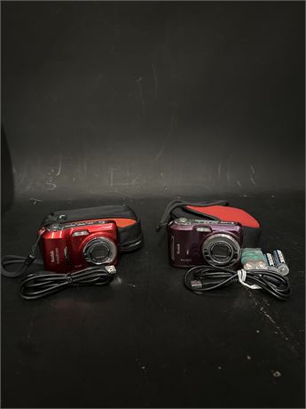 Two Canon PowerShot SX150 IS 14.1 MP Digital Cameras